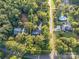 Aerial view showing the large lot size, mature trees, and driveway location at 8503 Foxbridge Dr # 16, Matthews, NC 28104