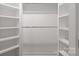 Walk-in closet featuring shelving and ample hanging space for storage at 8503 Foxbridge Dr # 16, Matthews, NC 28104