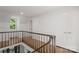 Hallway with hardwood floors, staircase, natural light and storage closet at 8503 Foxbridge Dr # 16, Matthews, NC 28104