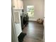 Laundry room featuring a dog bath, washer and dryer, and a large window for natural light at 8503 Foxbridge Dr # 16, Matthews, NC 28104