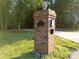 Brick mailbox with address on a lush green lot at 8503 Foxbridge Dr # 16, Matthews, NC 28104