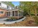 Screened-in back porch addition with a brick foundation and sidewalk at 8503 Foxbridge Dr # 16, Matthews, NC 28104