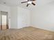 Bright bedroom with neutral carpeting and ceiling fan at 9667 Laurie Nw Ave, Concord, NC 28027