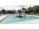 Community pool with water features and a playground at 9667 Laurie Nw Ave, Concord, NC 28027