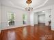 Formal dining room with hardwood floors and chandelier at 9667 Laurie Nw Ave, Concord, NC 28027