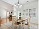 Kitchen breakfast area with wood table and chandelier at 9667 Laurie Nw Ave, Concord, NC 28027