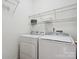 Laundry room with washer, dryer, and ample shelving at 9667 Laurie Nw Ave, Concord, NC 28027