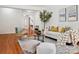 Living room with hardwood floors, comfy seating and rug at 9667 Laurie Nw Ave, Concord, NC 28027