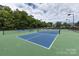 Two well-maintained tennis courts at 9667 Laurie Nw Ave, Concord, NC 28027