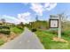 Paved walking trail with signage at 9667 Laurie Nw Ave, Concord, NC 28027