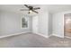 Spacious bedroom with ceiling fan and carpeted floor at 208 Valley St, Stanley, NC 28164