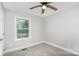 Simple bedroom with carpet flooring and a window at 208 Valley St, Stanley, NC 28164