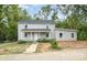 Newly renovated two-story house with gray siding and a small front yard at 208 Valley St, Stanley, NC 28164