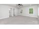 Spacious main bedroom with carpet, double closets, and access to bathroom at 208 Valley St, Stanley, NC 28164