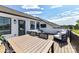 Outdoor deck features a dining set, lounge seating, and stunning views at 3020 Endhaven Terraces Ln # 10, Charlotte, NC 28277