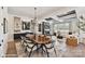 Dining area with modern chandelier and view into the stylish living room at 3020 Endhaven Terraces Ln # 10, Charlotte, NC 28277