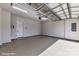 Clean, epoxy floored two-car garage with modern lighting and ample space at 3020 Endhaven Terraces Ln # 10, Charlotte, NC 28277