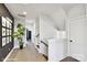 Bright hallway showcasing hardwood floors, white trim, and a plant adding a touch of nature at 3020 Endhaven Terraces Ln # 10, Charlotte, NC 28277