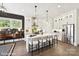 Bright kitchen with a center island, stainless steel appliances, and modern pendant lighting at 3020 Endhaven Terraces Ln # 10, Charlotte, NC 28277