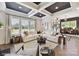 Bright living room with coffered ceiling, large windows, and stylish neutral decor at 3020 Endhaven Terraces Ln # 10, Charlotte, NC 28277