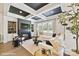 Cozy living room featuring a fireplace, built-in shelving, and large windows at 3020 Endhaven Terraces Ln # 10, Charlotte, NC 28277
