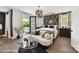 Elegant main bedroom with balcony access, featuring a cozy seating area and decorative accents at 3020 Endhaven Terraces Ln # 10, Charlotte, NC 28277