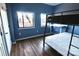 Blue bedroom with a bunk bed and hardwood floors at 715 N Church St # 304, Charlotte, NC 28202