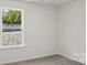 Neutral bedroom featuring natural light from an outside window at 112 Rustling Waters Dr, Mooresville, NC 28117