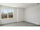 Bedroom featuring bright window and plush carpet at 112 Rustling Waters Dr, Mooresville, NC 28117