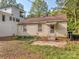 Backyard view of a house needing some repairs at 2117 Laburnum Ave, Charlotte, NC 28205