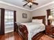 Bright bedroom with a sleigh bed, hardwood floors, and window with blinds at 4730 Rollins Pointe Dr, Monroe, NC 28110