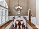 Formal dining room with large windows and chandelier at 4730 Rollins Pointe Dr, Monroe, NC 28110