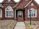 Brick front entrance with a walkway and lamp at 4730 Rollins Pointe Dr, Monroe, NC 28110