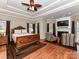 Large main bedroom with hardwood floors and a fireplace at 4730 Rollins Pointe Dr, Monroe, NC 28110