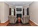 Cozy sitting area with fireplace and hardwood floors at 4730 Rollins Pointe Dr, Monroe, NC 28110