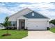 Charming single-story home featuring stone accents, a two-car garage, and a well-manicured front yard at 3607 Clover Valley Dr, Gastonia, NC 28052