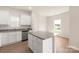 Bright kitchen featuring white cabinetry, granite countertops, stainless steel appliances, and an island at 3607 Clover Valley Dr, Gastonia, NC 28052