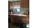 Kitchen with a window, wood cabinets, and a sink at 5820 Scotland Yard Rd, Rock Hill, SC 29732