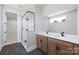 Bathroom featuring double sinks, framed mirrors, and a separate glass-enclosed shower with modern fixtures at 97 Seven Oaks Lndg, Belmont, NC 28012