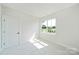 This cozy, well-lit bedroom boasts ample natural light and a view of the neighborhood at 97 Seven Oaks Lndg, Belmont, NC 28012