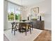 Bright dining room with modern light fixture, table with seating for four, and stylish decor at 97 Seven Oaks Lndg, Belmont, NC 28012