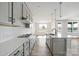 Modern kitchen featuring gray cabinets, white countertops, stainless appliances, and a central island with sink at 97 Seven Oaks Lndg, Belmont, NC 28012