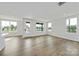 Bright living room featuring wood floors, recessed lighting, and multiple windows offering natural light at 97 Seven Oaks Lndg, Belmont, NC 28012
