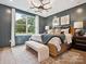 Cozy main bedroom with elegant decor, wood-look flooring, and a large window offering scenic views at 97 Seven Oaks Lndg, Belmont, NC 28012