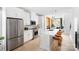 Modern white kitchen featuring stainless steel appliances, a large island, and pendant lighting at 1340 Hamilton St # 3, Charlotte, NC 28206