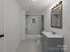 Updated bathroom with gray vanity and shower/tub at 225 York Ave, Kannapolis, NC 28083