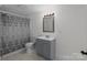 Clean bathroom with gray vanity and shower/tub combo at 225 York Ave, Kannapolis, NC 28083