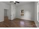 Well-lit bedroom with hardwood floors, ceiling fan, and window at 225 York Ave, Kannapolis, NC 28083