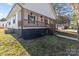 Side view of the house showcasing the porch and landscaping at 225 York Ave, Kannapolis, NC 28083