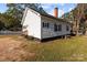 Charming white house with side view and yard at 225 York Ave, Kannapolis, NC 28083